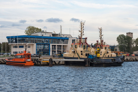 Ship row along the harbor shoreline.の写真素材