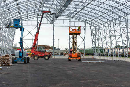 Lift with platform work in warehouse hangar construction field.の写真素材