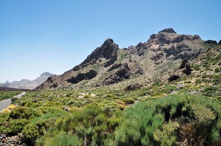 Mountain road to volcano Teide among rocky mountains on Tenerife island.の写真素材
