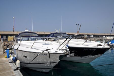 TENERIFE, SPAIN - JULY 1, 2011: Motorboats at the berth.のeditorial素材