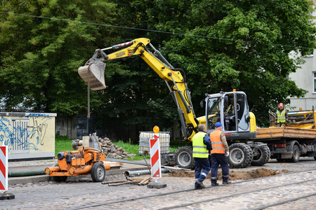 RIGA, LATVIA - SEPTEMBER 17, 2016: Workers repairing streets.のeditorial素材