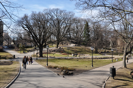 RIGA, LATVIA - APRIL 13, 2011: In the first warm days of spring after snowmelt unknown people walking along the Bastion.のeditorial素材
