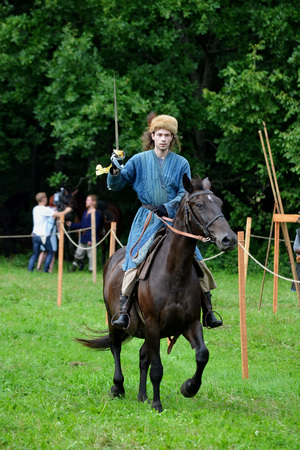 TERVETE, LATVIA - AUGUST 13, 2011: Historical Zemgalu days. Unknown rider on horseback in ancient clothing with ancient weapons.のeditorial素材