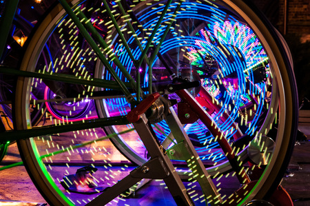 Abstract play of light with lights in bicycle wheel spokes.の写真素材