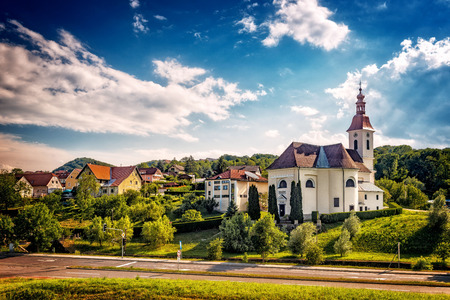 Austrian landscape. Church in a small town.の写真素材