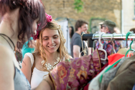 RIGA, LATVIA - MAY 24, 2014: Miera street Pentecost. Woman shopping in the market.のeditorial素材