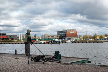 Saaremaa, Estonia, MAY 4, 2014: A man near the lake are fishing.のeditorial素材