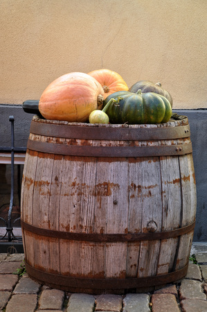 Close-up photography. Pumpkins on old wooden barrels.の写真素材