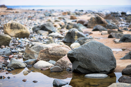Close-up photography. Full sea edge with colored stones.の写真素材