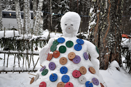 Snowman with a lot of huge buttons.の写真素材