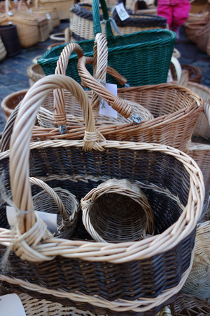 In the christmas  market a wide selection of a variety of hand-braided baskets.の写真素材