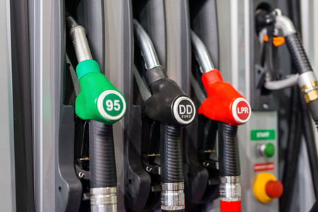 Colorful Petrol pump filling nozzles , Gas station in a service in daytime.の写真素材