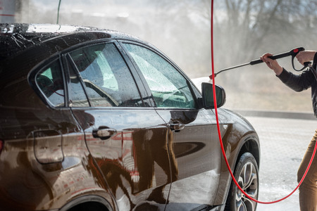Car without touch washing self-service. Wash with water and foam.の写真素材