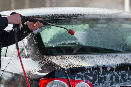 Car without touch washing self-service. Wash with water and foam.の写真素材