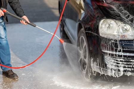 Car without touch washing self-service. Wash with water and foam.の写真素材