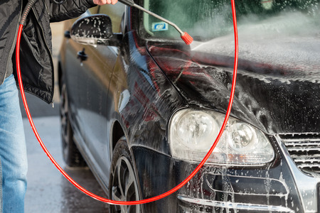 Car without touch washing self-service. Wash with water and foam.の写真素材