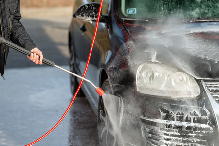 Car without touch washing self-service. Wash with water and foam.の写真素材