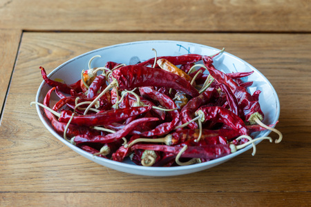 Red Hot Chili Peppers in bowl on a table.の写真素材