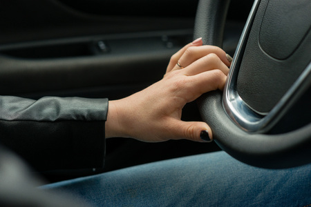 Women hands on the car's steering wheel.の写真素材