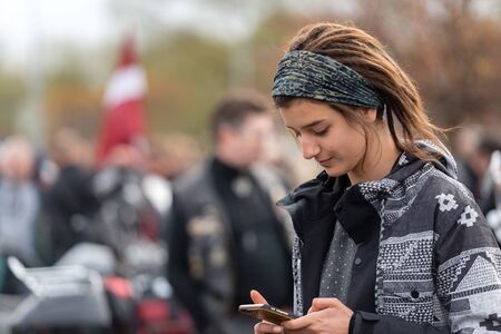 RIGA, LATVIA - APRIL 28, 2018: 2018 Moto Season Opening Event. Motorcyclists gather for a parade trip. Motorcyclists meet and talk before the trip.のeditorial素材