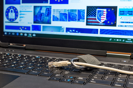 lock and network cable as symbol for Privacy and General Data Protection Regulation on a notebook computerの写真素材