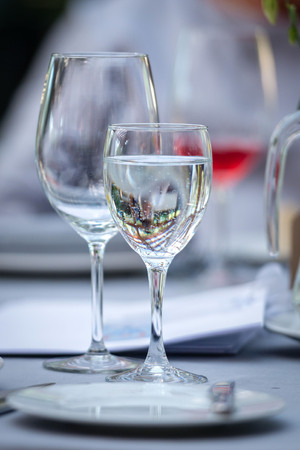 Table laying concept. On the table there are glasses and a mug with drinking water.
の写真素材
