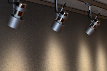 Brown-yellow background with texture. The background is illuminated by four ceiling lights. Selective focus photography.の写真素材