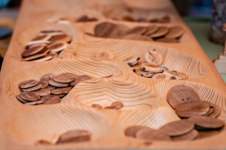 Wooden buttons and keychains in the souvenir shop.の写真素材