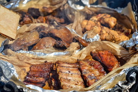 Different fried and grilled meat on a large pan.の写真素材
