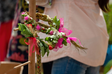 Wooden stand with the flowers braided crown. The Latvian Ligo holiday attribute.の写真素材