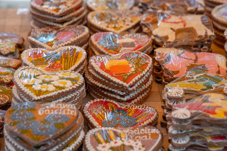 Different gingerbread hearts in the store on the table.の写真素材