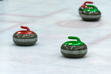 Granite stones for curling game on the iceの写真素材