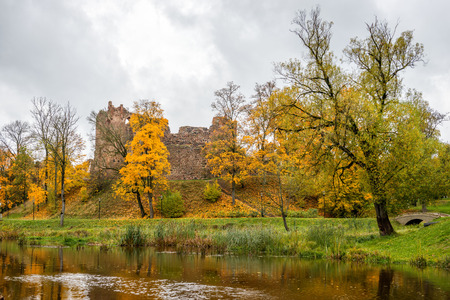Dobele. Latvia. Autumn landscape with medieval castle ruins and river.の写真素材