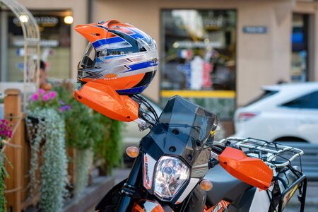 RIGA, LATVIA - JULY 31, 2018: Enduro motorcycle stands on the street side at the outdoor cafe.
