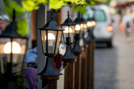 Decorative lanterns along the street cafe barrier.の写真素材