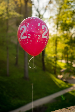 Red balloon with stars and a number 2.の写真素材