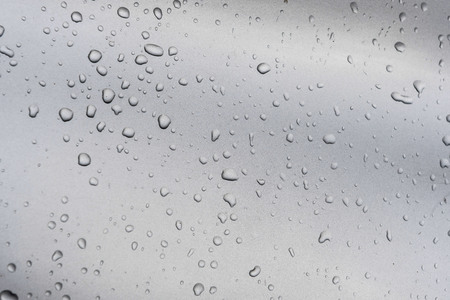 Abstract background Rain drops on a gray background.