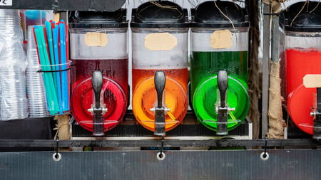 Slush ice drink containers with colorful ice drinks.の写真素材