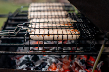 closeup of sausages on the barbecue in outdoorの写真素材