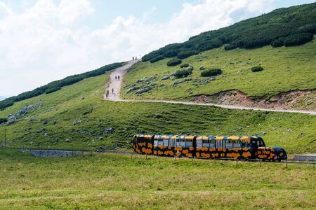 PUCHBERG, AUSTRIA, - AUGUST 9, 2018: .Rack railway named Salamander on way to Schneeberg mountain, preferred tourist attraction in Lower Austria.のeditorial素材