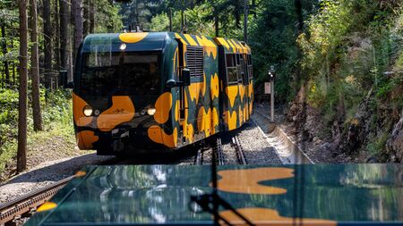 PUCHBERG, AUSTRIA, - AUGUST 9, 2018: Rack railway named Salamander on way to Schneeberg mountain. View from the train.のeditorial素材