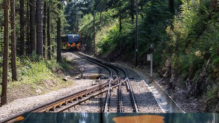 PUCHBERG, AUSTRIA, - AUGUST 9, 2018: Rack railway named Salamander on way to Schneeberg mountain. View from the train.のeditorial素材