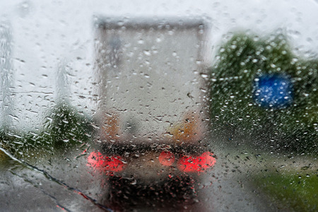 Abstract background - View through a rain drop on a truck.