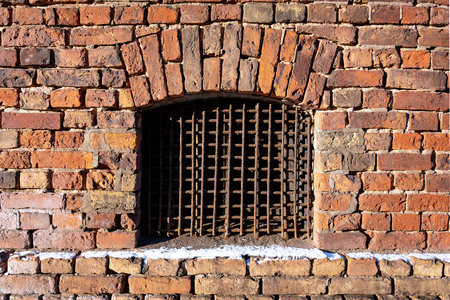 Front close-up view of a vintage brick with a window - Imageの写真素材