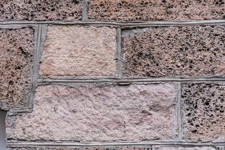 Close-up photo. Fragment of an old masonry wall.