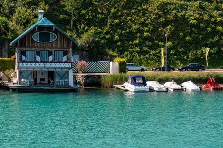 WORTHERSEE, AUSTRIA - AUGUST 08, 2018:  Great scenery from the boat to the shore line of the lake,...