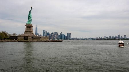 New York, USA - June 7, 2019: Statue of Liberty, Liberty Island, with Manhtattan in the background - Imageのeditorial素材