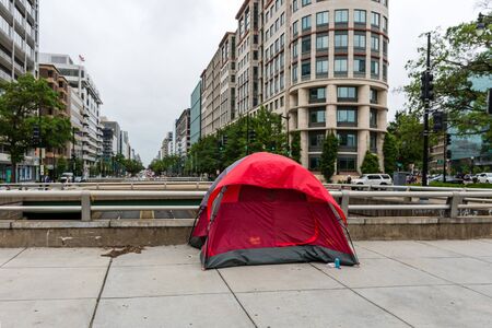 Washington DC, USA - June 9, 2019: Homeless persons tent in the city  on the pedestrian walkway....