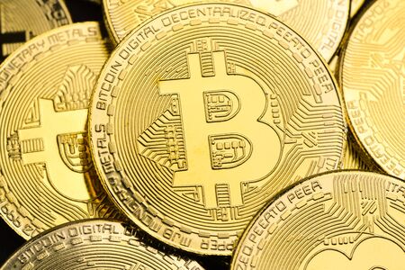 Shiny gold bitcoins as background,  Cryptocurrency and virtual money concept - imageの写真素材