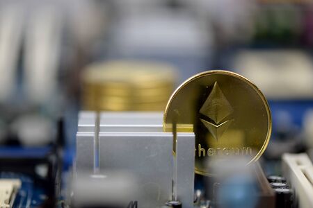 Golden Cryptocurrency coins on computer circuit board, selective focus  - image